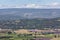 Panoramic view Luberon hills covered with lavender fields, vineyards, apple orchards, forests from top of historic hill villageÂ 
